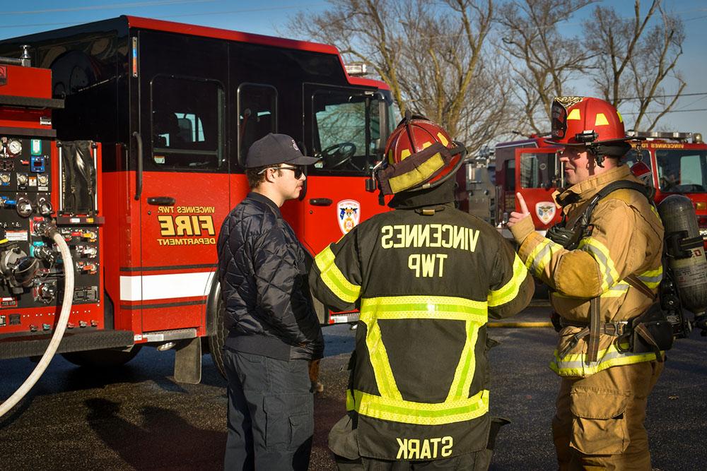 fire fighters and truck